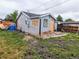 Exterior view of house showing the side with construction and stacked tiles at 6608 Hooker St, Denver, CO 80221