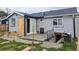 Exterior view of house showing the back with construction and stacked tiles at 6608 Hooker St, Denver, CO 80221