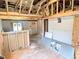 Living room with exposed beams, original hardwood, and new fixtures at 6608 Hooker St, Denver, CO 80221