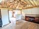 Spacious room with original hardwood floors and exposed beams for a rustic feel at 6608 Hooker St, Denver, CO 80221
