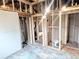 Room interior with exposed framing, original hardwood floors, and natural light at 6608 Hooker St, Denver, CO 80221