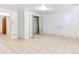 Basement with white walls, tile flooring, and closet with mirrored doors at 12022 W Louisiana Ave, Lakewood, CO 80228