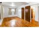 Spacious bedroom with hardwood floors, neutral walls, and dual closets, creating a serene retreat at 12022 W Louisiana Ave, Lakewood, CO 80228