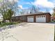 Well-maintained brick home with double garage, large driveway, and landscaping at 12022 W Louisiana Ave, Lakewood, CO 80228