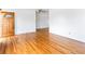 Inviting living room featuring gleaming hardwood floors and ample natural light, perfect for modern living and entertaining at 12022 W Louisiana Ave, Lakewood, CO 80228