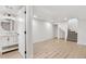 Basement space featuring a bathroom with modern vanity and tile floors at 3230 Newport St, Denver, CO 80207