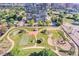Aerial view of the apartment complex including a tennis court, garden, and pool at 3131 E Alameda Ave # 1503, Denver, CO 80209