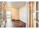 Bedroom boasts wood floors, French doors, and bright natural light at 3131 E Alameda Ave # 1503, Denver, CO 80209