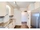 Kitchen features stainless steel appliances, stone counters, and modern cabinetry at 3131 E Alameda Ave # 1503, Denver, CO 80209