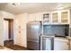 Kitchen features stainless steel appliances, stone counters, modern cabinetry, and tile backsplash at 3131 E Alameda Ave # 1503, Denver, CO 80209