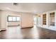 Open living room with refinished hardwood floors and lots of natural light at 3131 E Alameda Ave # 1503, Denver, CO 80209