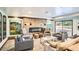 Resident lounge with modern fireplace, seating, and large windows at 3131 E Alameda Ave # 1503, Denver, CO 80209