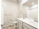Neutral bathroom featuring double sinks, a toilet, and shower with tub at 24088 E Atlantic Pl, Aurora, CO 80018