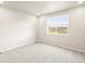 Neutral bedroom featuring a window, plush carpet and neutral-painted walls at 24088 E Atlantic Pl, Aurora, CO 80018