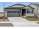 Charming single Gathering home with a two-car garage and stone accents at daytime at 24088 E Atlantic Pl, Aurora, CO 80018