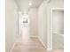 Well-lit hallway with hardwood flooring, connecting different areas of the home and creating a seamless flow at 24088 E Atlantic Pl, Aurora, CO 80018