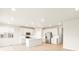 Modern kitchen featuring stainless steel appliances, a central island, and ample natural light, blending style and functionality at 24088 E Atlantic Pl, Aurora, CO 80018