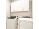 Laundry room features a new, matching washer and dryer set with white cabinets at 24088 E Atlantic Pl, Aurora, CO 80018