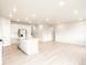 Open-concept living area showcases modern design with sleek floors, creating an inviting and spacious atmosphere for relaxation at 24088 E Atlantic Pl, Aurora, CO 80018