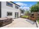 Backyard with a hot tub, patio, and well-maintained lawn at 11407 W 103Rd Ave, Broomfield, CO 80021