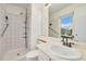 Bathroom features a walk-in shower, vanity sink, and window with natural light at 11407 W 103Rd Ave, Broomfield, CO 80021
