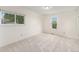 Bright bedroom with neutral carpet, multiple windows, and ample natural light at 11407 W 103Rd Ave, Broomfield, CO 80021