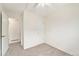 Neutral bedroom with two closets, neutral carpet, and ceiling fan at 11407 W 103Rd Ave, Broomfield, CO 80021
