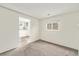 Carpeted bedroom offers ample natural light and a view of the backyard at 11407 W 103Rd Ave, Broomfield, CO 80021