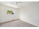 Bedroom featuring two closets, neutral carpet, and ample natural light at 11407 W 103Rd Ave, Broomfield, CO 80021