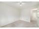 Neutral bedroom with a ceiling fan, carpet, and ample closet space at 11407 W 103Rd Ave, Broomfield, CO 80021