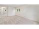 Neutral bedroom featuring a closet, neutral carpet, and large window at 11407 W 103Rd Ave, Broomfield, CO 80021