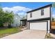 Two-story home with a garage, lawn, and a nearby home at 11407 W 103Rd Ave, Broomfield, CO 80021