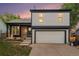 Two-story home featuring a garage and front yard at 11407 W 103Rd Ave, Broomfield, CO 80021
