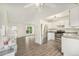 Bright kitchen features stainless steel appliances, wood-look flooring, and lots of cabinet space at 11407 W 103Rd Ave, Broomfield, CO 80021