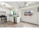 Spacious kitchen with stainless appliances, white cabinets and generous window with backyard view at 11407 W 103Rd Ave, Broomfield, CO 80021