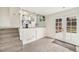 Open living room with stairs to the upper level and backyard access at 11407 W 103Rd Ave, Broomfield, CO 80021