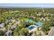 Aerial shot highlighting community amenities including a pool and tennis courts at 7869 S Valentia St, Centennial, CO 80112