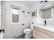 Well-lit bathroom featuring a modern vanity, round mirror, and stylish fixtures for a clean, contemporary feel at 7869 S Valentia St, Centennial, CO 80112