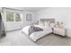 Bright bedroom with a large window, comfortable bed, and modern decor at 7869 S Valentia St, Centennial, CO 80112