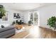 Bright living room with a sliding glass door, modern furniture, and decorative accents at 7869 S Valentia St, Centennial, CO 80112