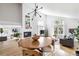 Inviting living room with fireplace, high ceilings, hardwood floors, and lots of natural light at 7869 S Valentia St, Centennial, CO 80112