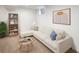 Cozy living room featuring a comfortable white sectional sofa, stylish coffee table, and modern decor at 7869 S Valentia St, Centennial, CO 80112