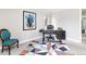 Inviting home office with a stylish desk, comfortable chair, and colorful rug creating a productive workspace at 7869 S Valentia St, Centennial, CO 80112