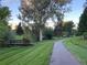 Scenic park pathway winding through lush greenery and mature trees, ideal for strolls at 7869 S Valentia St, Centennial, CO 80112