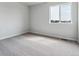 Light-filled bedroom with neutral carpet and a view from the window at 14378 Heritage Dr, Mead, CO 80504