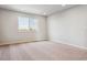 Light-filled bedroom with neutral carpet, a window and minimal decor at 14378 Heritage Dr, Mead, CO 80504