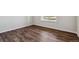 Bedroom with hardwood flooring and bright natural light from the large window at 14378 Heritage Dr, Mead, CO 80504