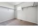 Large walk-in closet with neutral carpeting and hanging storage racks at 14378 Heritage Dr, Mead, CO 80504