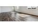Spacious living room featuring wood-style floors, windows, and natural light at 14378 Heritage Dr, Mead, CO 80504