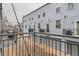 Apartment building exterior featuring attached garages and private balconies at 4575 Tennyson St # 104, Denver, CO 80212